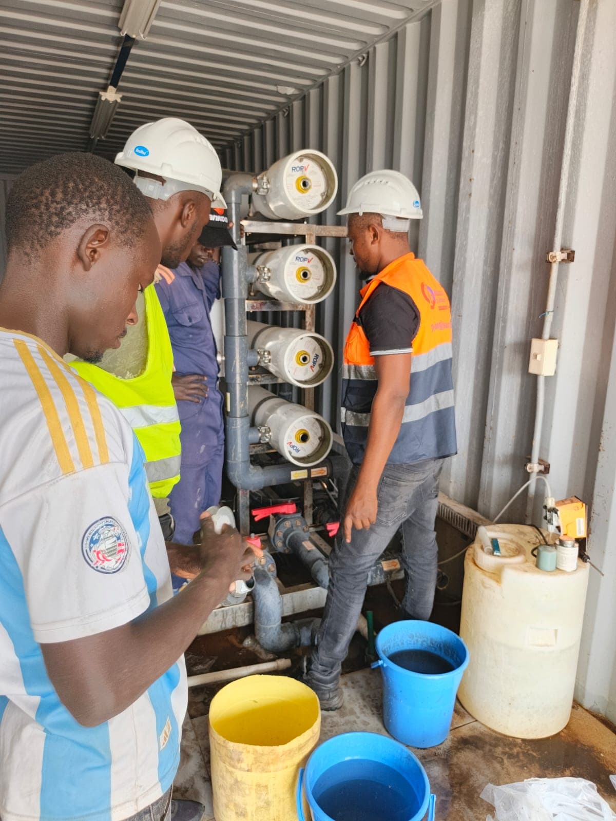 Technicians installing equipment